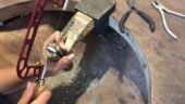 Making a silver ring.